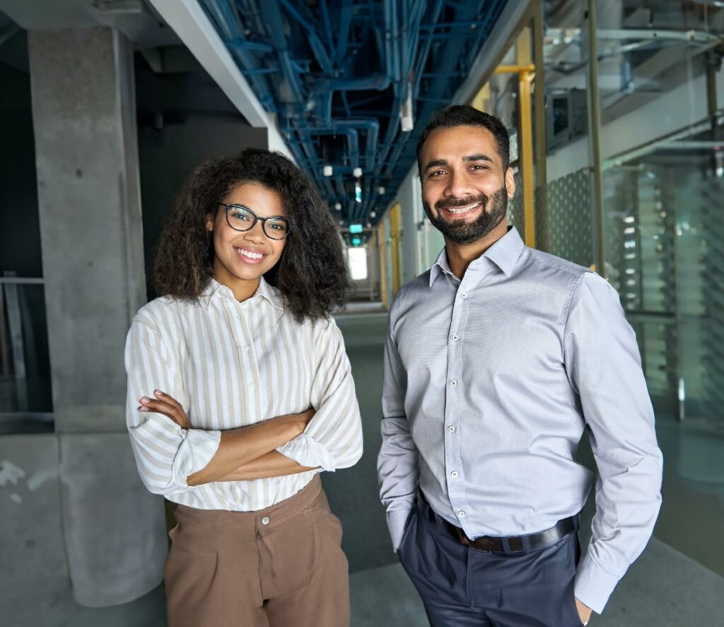 Smiling business partners in a corridor